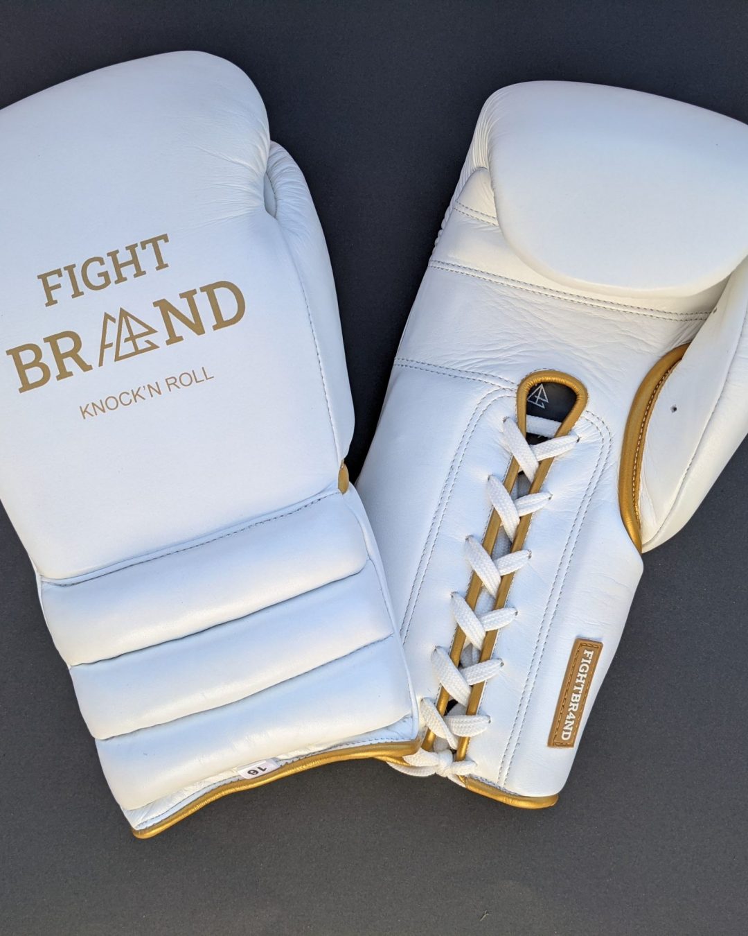 White and gold boxing gloves