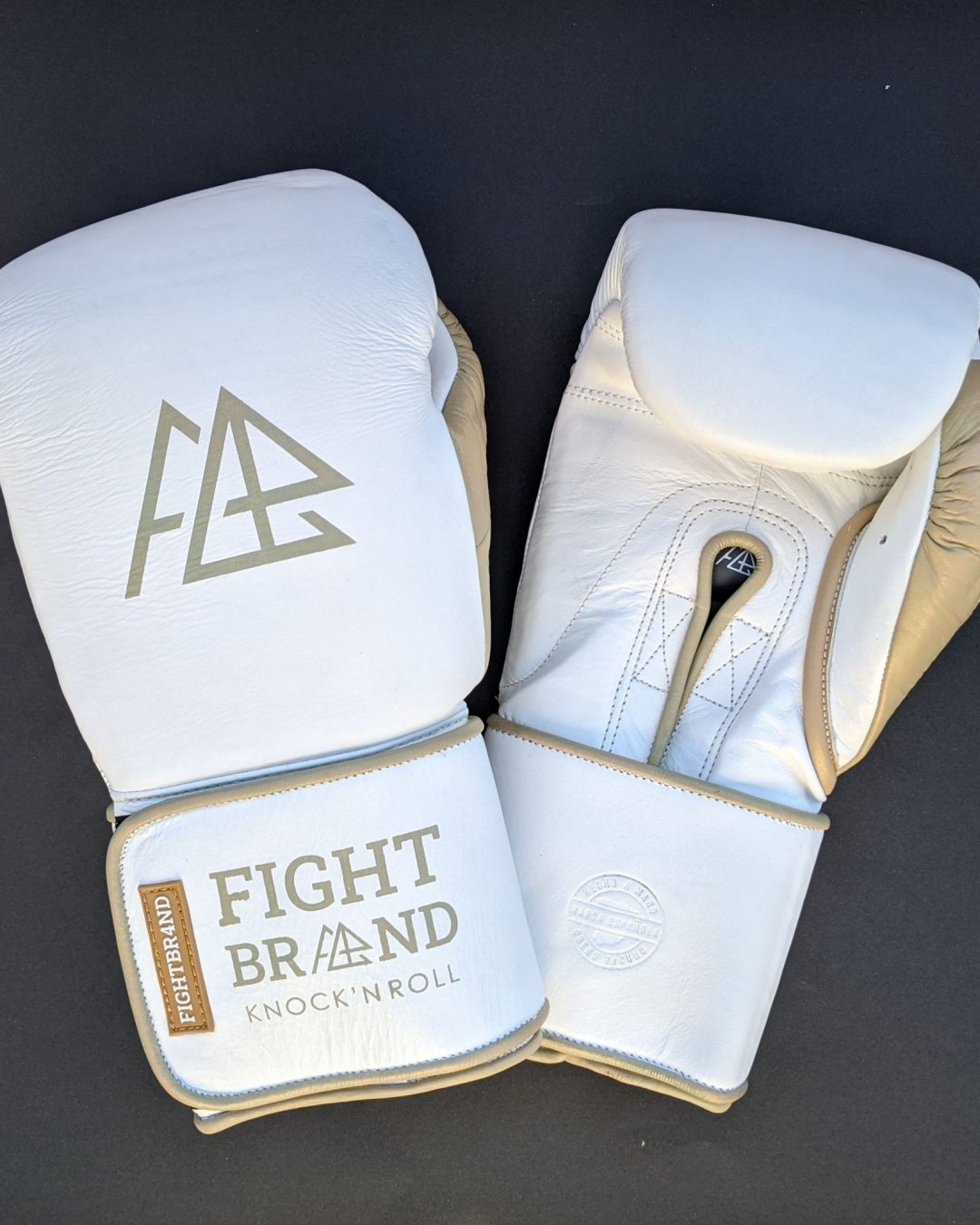 White and gold boxing gloves