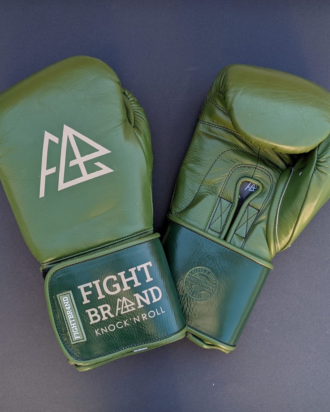 Green and gold boxing gloves